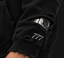 777 Timeless Hoodie – sleeve cutout and 777 embroidery